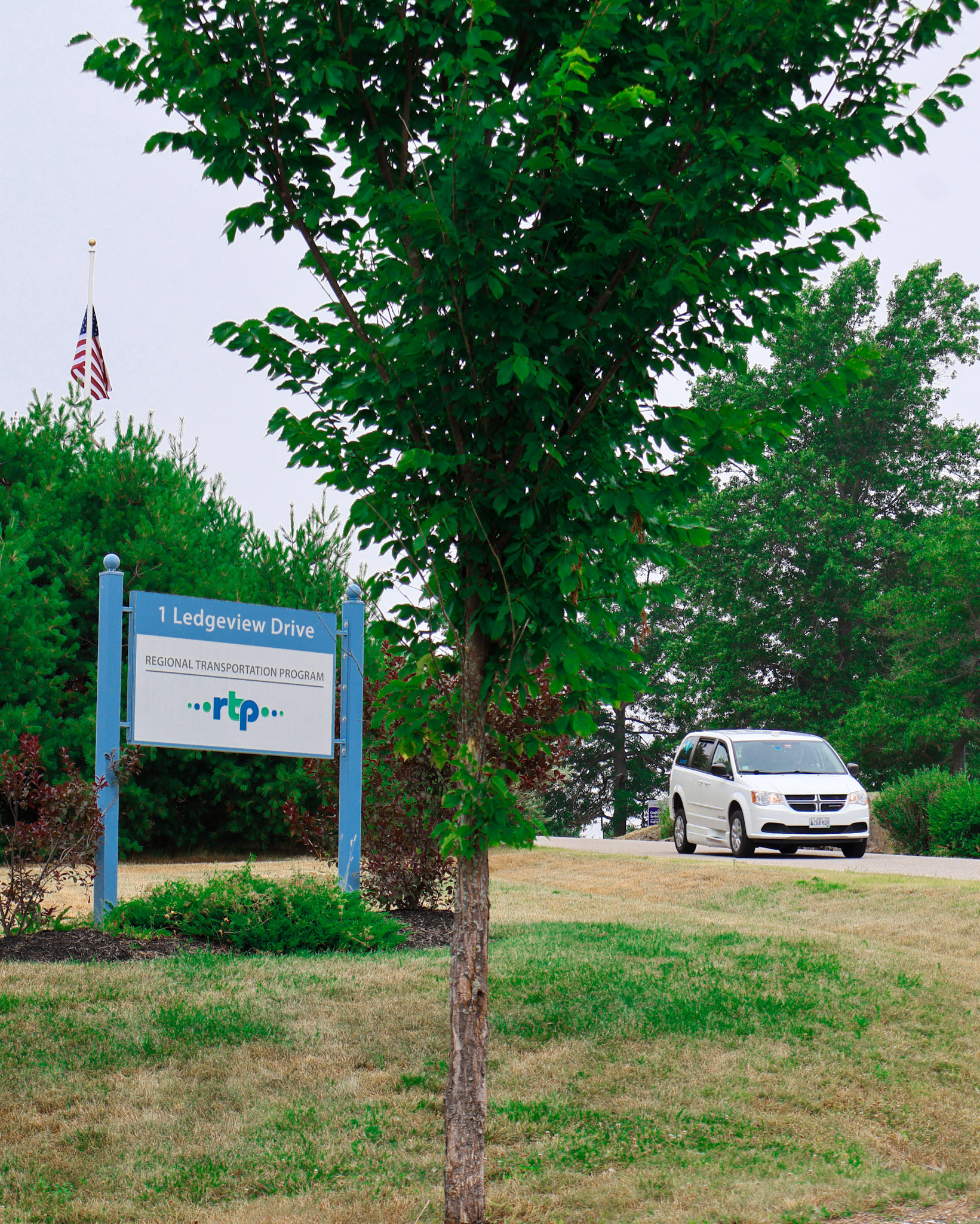 Review your donation using the cart page on our website. Photo of the RTP rides sign with an RTP van in the background in Maine