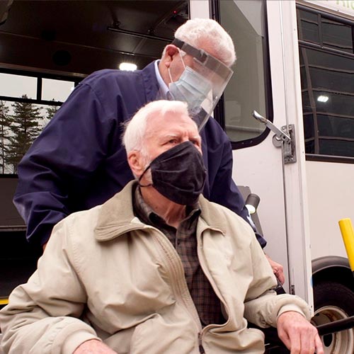 RTP Driver Helping Man In A Wheel Chair Into Bus